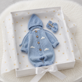 100% Hand Knitted Newborn Clouds Detail 3-Piece Set – Blue Romper, Bonnet & Booties displayed together in a premium gift box