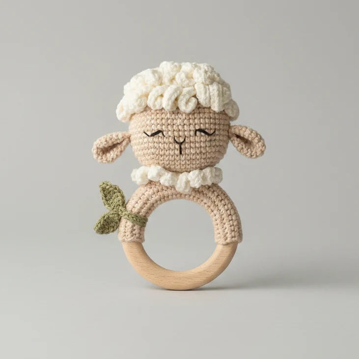 Stuffed sheep teether rattle with crocheted outfit and rounded wooden ring