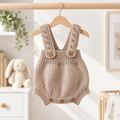 Newborn brown crochet dungaree romper with button straps and front snap buttons
