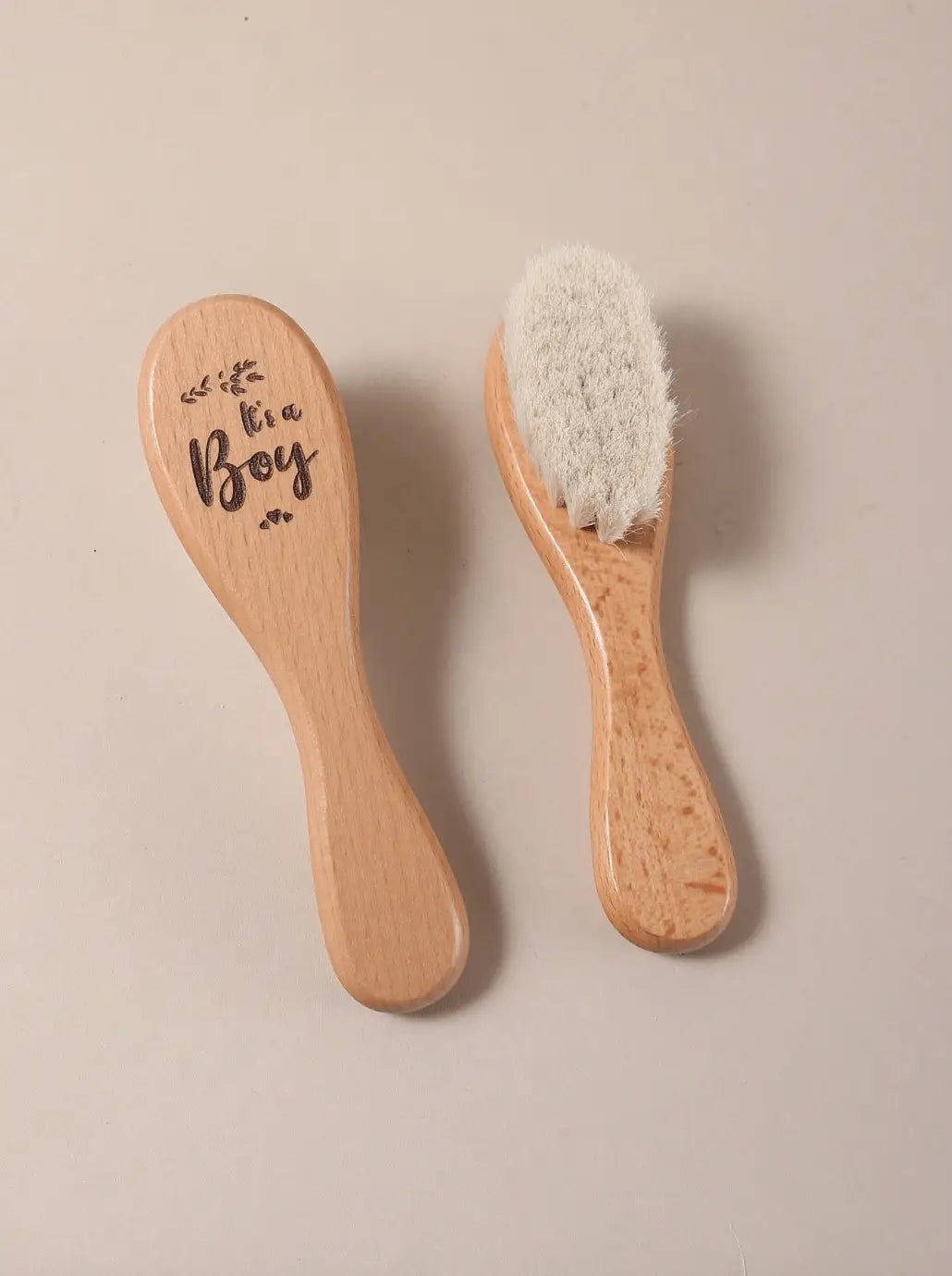 Two beechwood baby hair brushes with soft bristles, wooden handles side by side