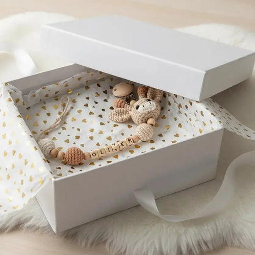 Crochet dummy clip garland with knit animal beads in neutral tan and cream