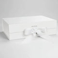 White rectangular gift box with drawer-style front and white bow ribbon