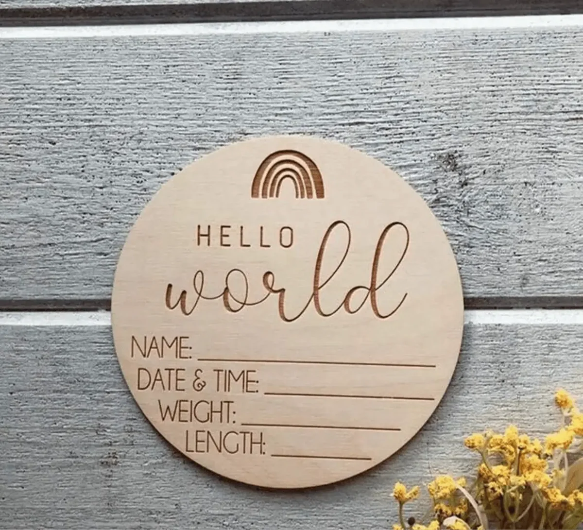 Round wooden baby photo card engraved 'Hello World' with rainbow and blank fields