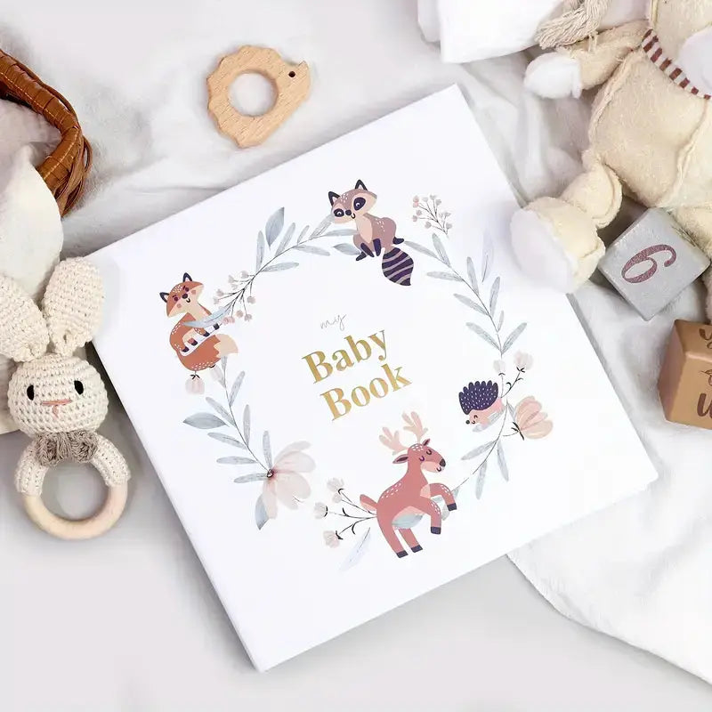 Luxury baby memory book with white cover and gold foiled “Baby Book” title
