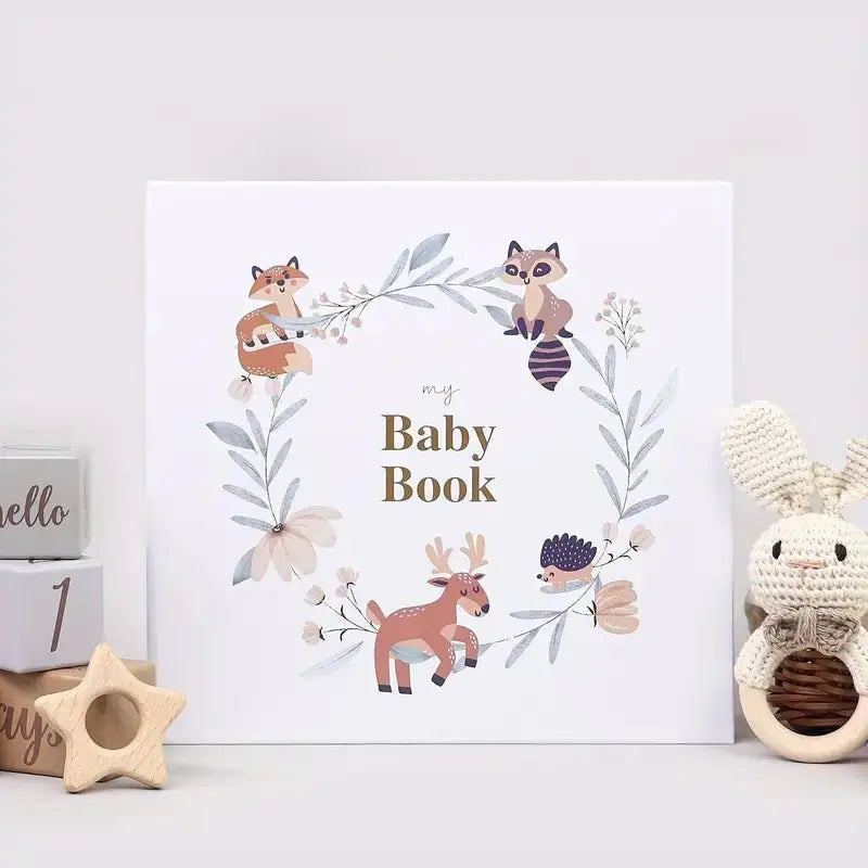 Baby memory book with illustrated woodland animals and gold foiled “Baby Book” title