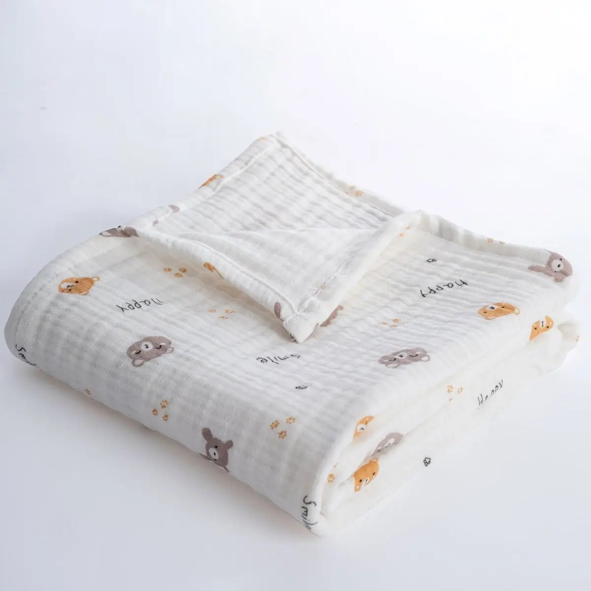 White muslin baby blanket, folded with repeating teddy animal print and soft gauze texture
