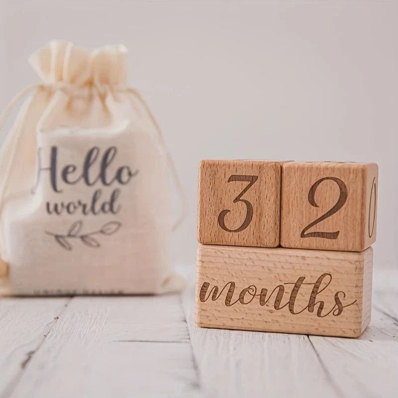 Wooden milestone blocks with number cubes 3 and 2 and 'months' script