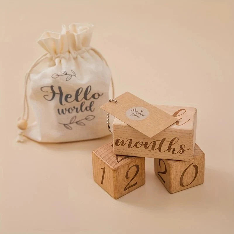 Wooden milestone blocks stacked with numbers 1, 2, and 0 plus 'months'